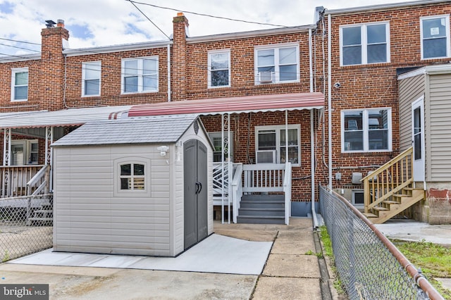 1518 Becklow Ave, Baltimore, MD 21220 - rear view of property featuring brick siding and a fenced backyard