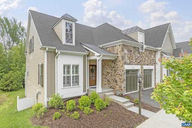 336 Avondale Ln, Crozet, VA 22932 - view of front facade featuring asphalt driveway, an attached garage, roof with shingles, and stone siding