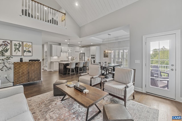 336 Avondale Ln, Crozet, VA 22932 - living room with wood finished floors, recessed lighting, baseboards, and high vaulted ceiling