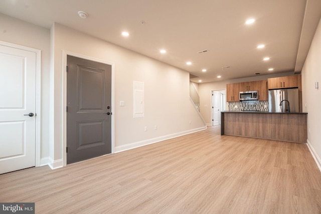 4096 Conshohocken Ave Unit A2, Philadelphia, PA 19131 - unfurnished living room featuring light wood-style flooring, baseboards, recessed lighting, and electric panel