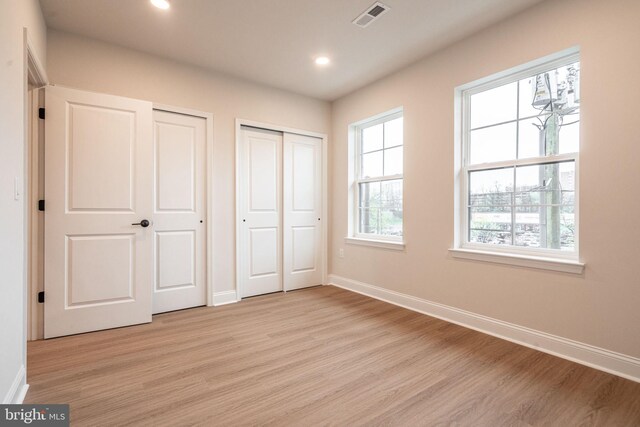 4096 Conshohocken Ave Unit A2, Philadelphia, PA 19131 - unfurnished bedroom featuring two closets, light wood-style flooring, baseboards, and recessed lighting