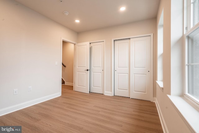 4096 Conshohocken Ave Unit A2, Philadelphia, PA 19131 - unfurnished bedroom with two closets, light wood finished floors, baseboards, and recessed lighting