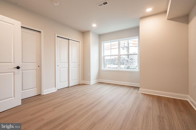 4096 Conshohocken Ave Unit A2, Philadelphia, PA 19131 - unfurnished bedroom featuring multiple closets, light wood finished floors, recessed lighting, and baseboards