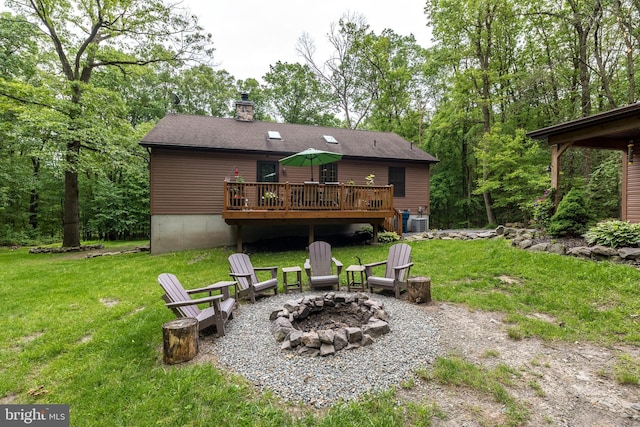 2733 Wood Ln, Morgantown, PA 19543 - rear view of property with an outdoor fire pit, a deck, a yard, a chimney, and cooling unit