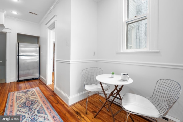 4022 Illinois Ave NW, Washington, DC 20011 - dining space featuring hardwood / wood-style floors, crown molding, baseboards, and recessed lighting
