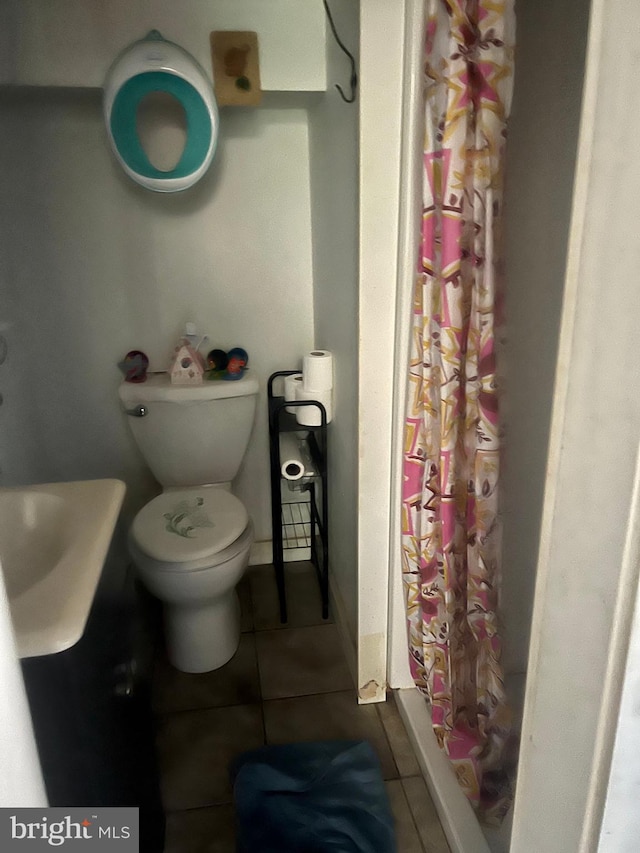 3706 36th St, Mount Rainier, MD 20712 - bathroom featuring tile patterned floors, a shower with shower curtain, toilet, and a sink