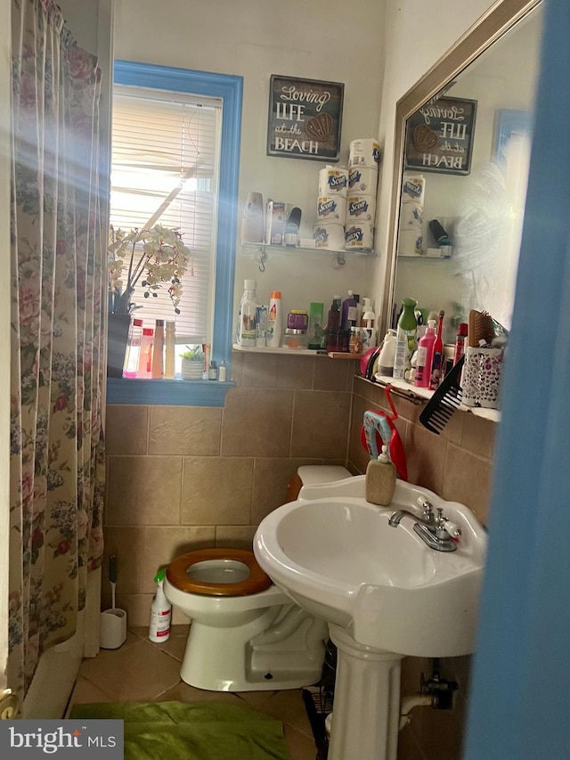 3706 36th St, Mount Rainier, MD 20712 - bathroom with tile walls, toilet, tile patterned flooring, and a shower with shower curtain
