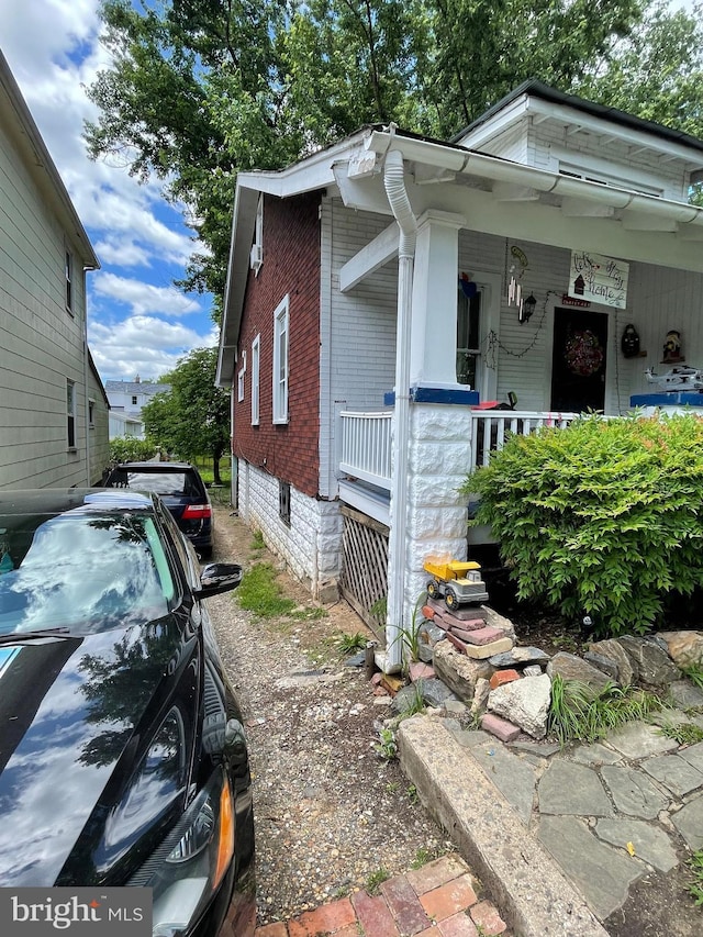 3706 36th St, Mount Rainier, MD 20712 - view of side of property featuring brick siding and covered porch