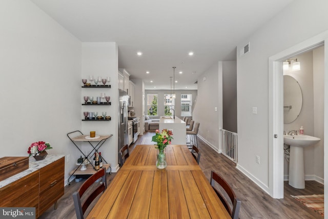 2510 Crimson Fox Dr, Hyattsville, MD 20782 - dining area with wood finished floors, baseboards, and recessed lighting