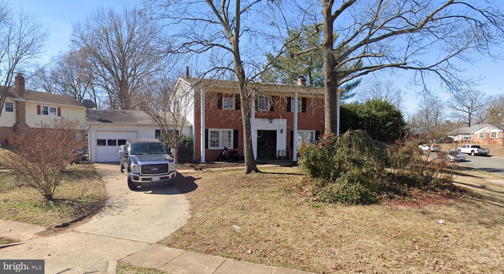 7506 Todd Pl, Manassas, VA 20109 - neoclassical home featuring a garage and concrete driveway