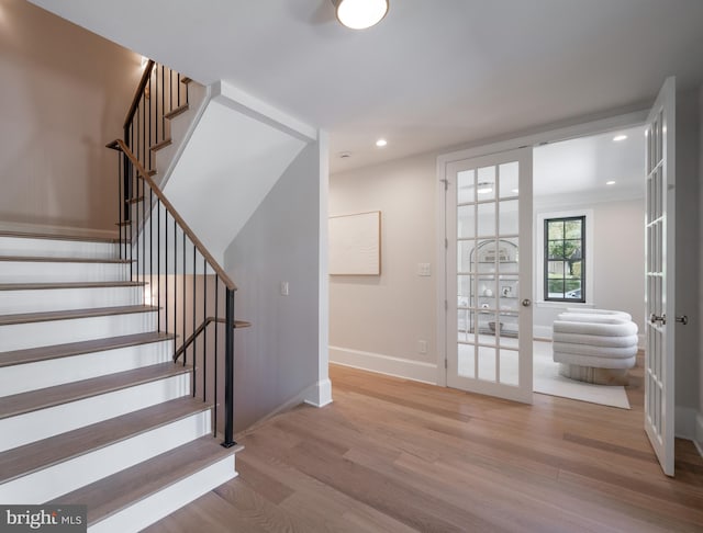 6040 Nebraska Ave NW, Washington, DC 20015 - staircase featuring wood finished floors, baseboards, french doors, and recessed lighting