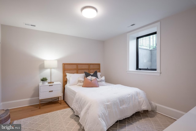 6040 Nebraska Ave NW, Washington, DC 20015 - bedroom with light wood-type flooring and baseboards