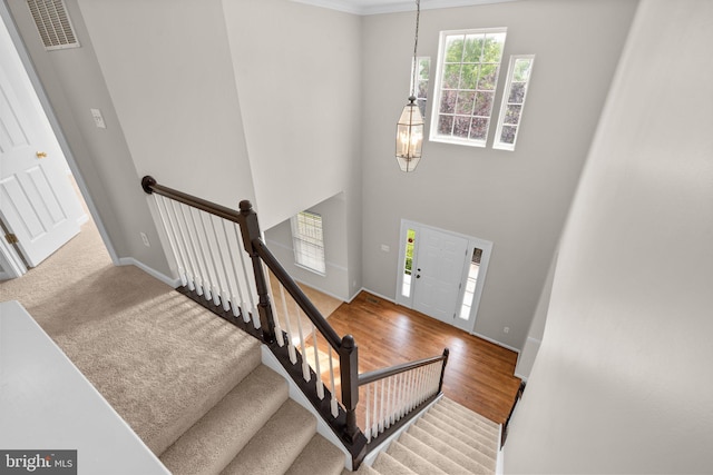 6404 Distant Melody Pl, Columbia, MD 21044 - entryway with baseboards, a chandelier, and stairway