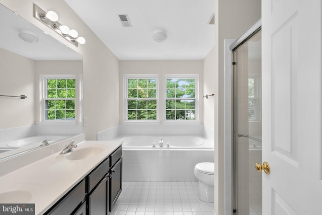 6404 Distant Melody Pl, Columbia, MD 21044 - bathroom with a garden tub, double vanity, toilet, a shower stall, and tile patterned flooring