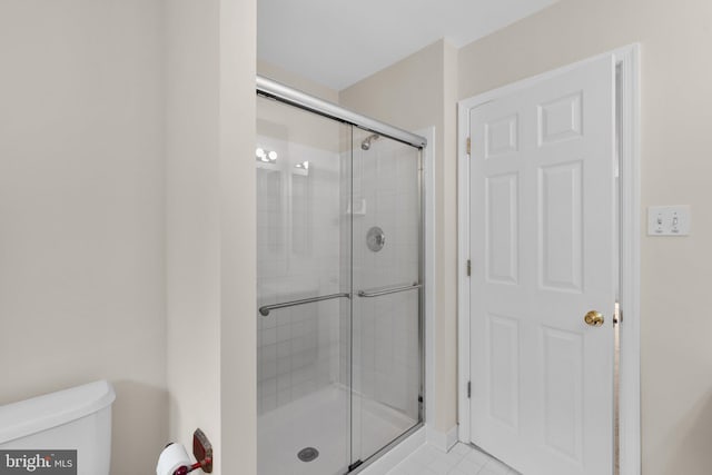 6404 Distant Melody Pl, Columbia, MD 21044 - bathroom featuring toilet, a shower stall, and tile patterned flooring
