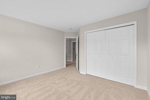 6404 Distant Melody Pl, Columbia, MD 21044 - unfurnished bedroom with carpet, baseboards, and a closet