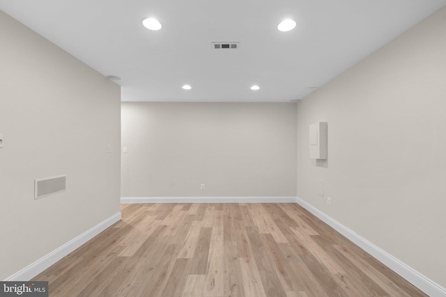 6404 Distant Melody Pl, Columbia, MD 21044 - unfurnished room featuring baseboards, light wood finished floors, and recessed lighting