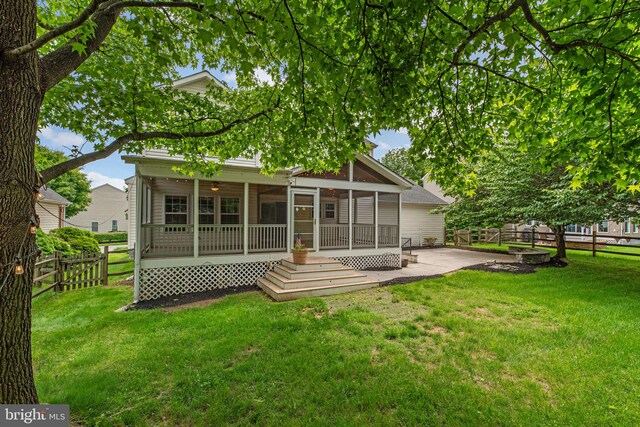 6404 Distant Melody Pl, Columbia, MD 21044 - rear view of house with a patio area and a sunroom