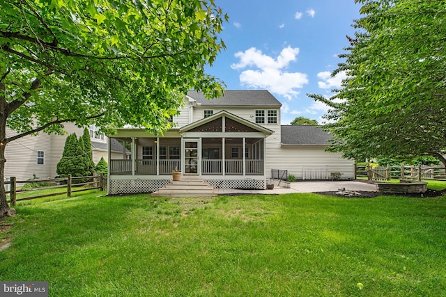 6404 Distant Melody Pl, Columbia, MD 21044 - back of house with a sunroom, a patio, and a shingled roof