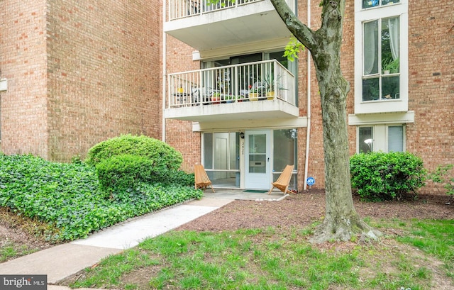 2525 Huntington Ave Unit 18, Alexandria, VA 22303 - property entrance featuring a balcony and brick siding