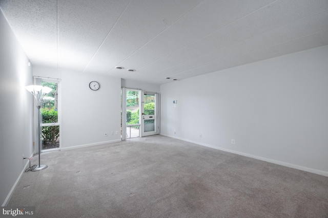2525 Huntington Ave Unit 18, Alexandria, VA 22303 - empty room with healthy amount of natural light, carpet flooring, a textured ceiling, and baseboards
