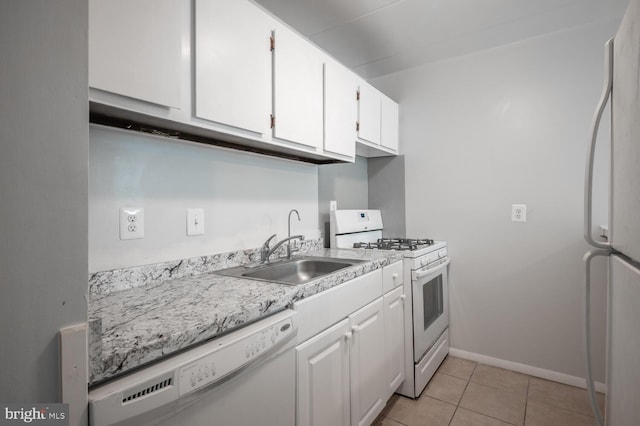 2525 Huntington Ave Unit 18, Alexandria, VA 22303 - kitchen with white appliances, a sink, white cabinets, light countertops, and light tile patterned floors