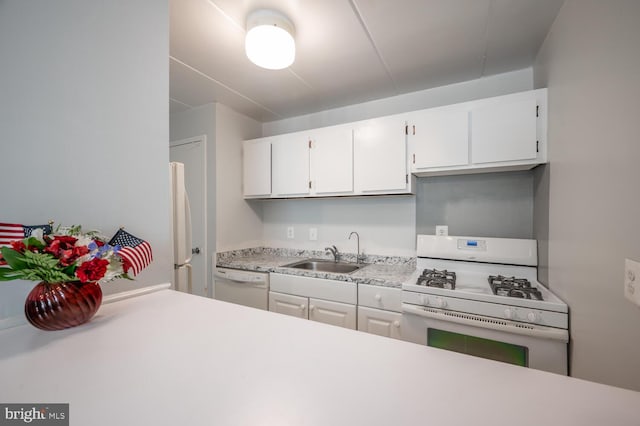 2525 Huntington Ave Unit 18, Alexandria, VA 22303 - kitchen featuring white appliances, a sink, light countertops, and white cabinetry