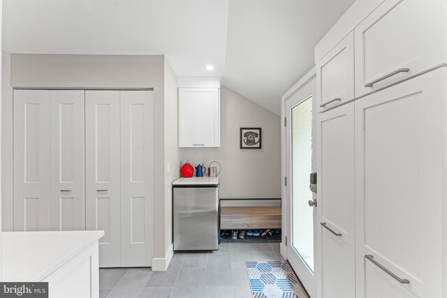 1110 Clover Hill Rd, Wynnewood, PA 19096 - mudroom with light tile patterned floors, recessed lighting, baseboards, and vaulted ceiling