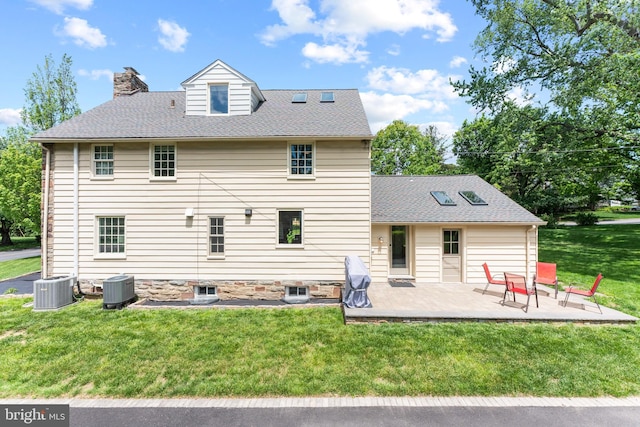 1110 Clover Hill Rd, Wynnewood, PA 19096 - rear view of house with a lawn, a patio, a chimney, and cooling unit