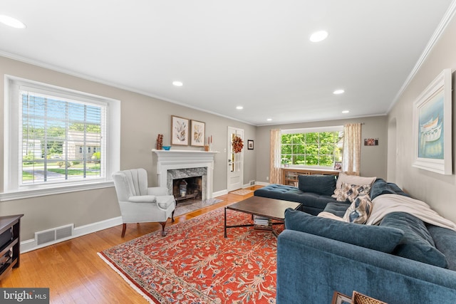 1110 Clover Hill Rd, Wynnewood, PA 19096 - living room featuring ornamental molding, light wood-type flooring, a premium fireplace, baseboards, and recessed lighting