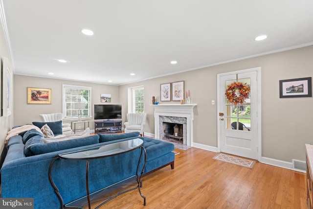 1110 Clover Hill Rd, Wynnewood, PA 19096 - living area with baseboards, crown molding, light wood-type flooring, a high end fireplace, and recessed lighting