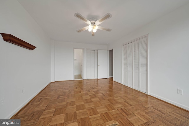 4301 Massachusetts Ave NW Unit 8009, Washington, DC 20016 - unfurnished bedroom with baseboards, a ceiling fan, multiple closets, and ensuite bathroom