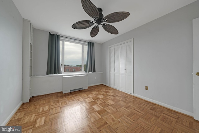 4301 Massachusetts Ave NW Unit 8009, Washington, DC 20016 - unfurnished bedroom featuring radiator, baseboards, a closet, and a ceiling fan