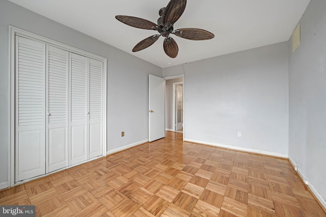 4301 Massachusetts Ave NW Unit 8009, Washington, DC 20016 - unfurnished bedroom featuring baseboards, a closet, and a ceiling fan