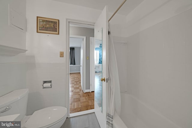 4301 Massachusetts Ave NW Unit 8009, Washington, DC 20016 - full bathroom with toilet, shower / tub combo, parquet floors, and tile walls