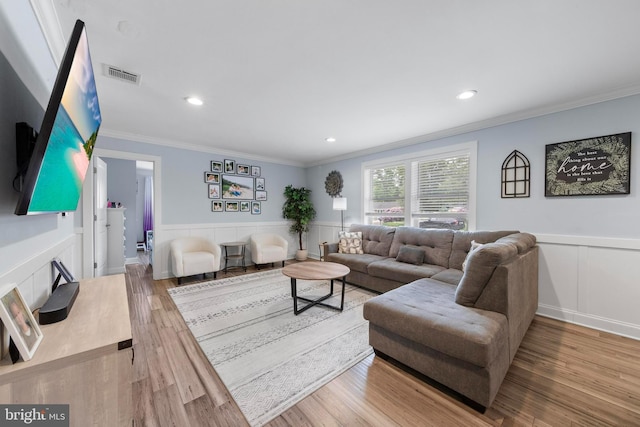 420 Conifer Dr, Forked River, NJ 08731 - living room with wainscoting, ornamental molding, a decorative wall, recessed lighting, and wood finished floors