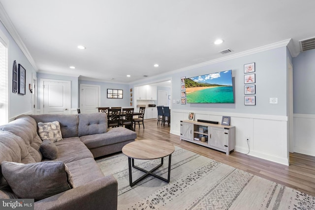 420 Conifer Dr, Forked River, NJ 08731 - living area featuring crown molding, light wood-style floors, wainscoting, and recessed lighting