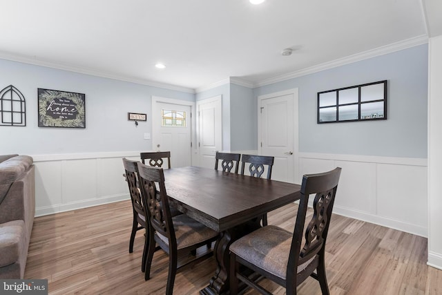 420 Conifer Dr, Forked River, NJ 08731 - dining room with ornamental molding, a decorative wall, light wood finished floors, wainscoting, and recessed lighting