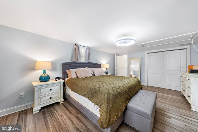 420 Conifer Dr, Forked River, NJ 08731 - bedroom featuring attic access, a closet, wood finished floors, and baseboards