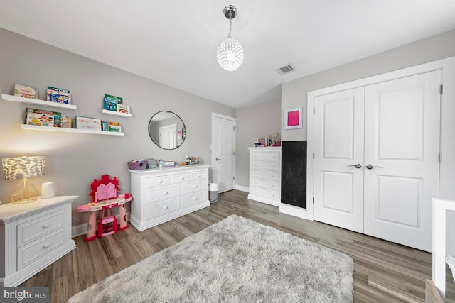 420 Conifer Dr, Forked River, NJ 08731 - bedroom with wood finished floors, baseboards, and a closet