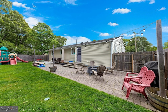 420 Conifer Dr, Forked River, NJ 08731 - rear view of house featuring an outdoor fire pit, a patio area, and a playground