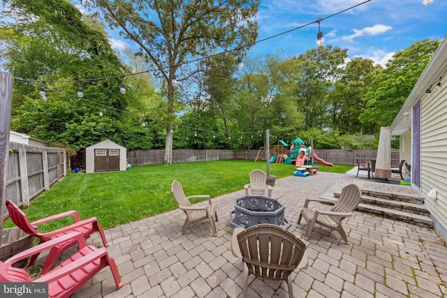 420 Conifer Dr, Forked River, NJ 08731 - view of patio with an outdoor fire pit, a playground, and view of scattered trees