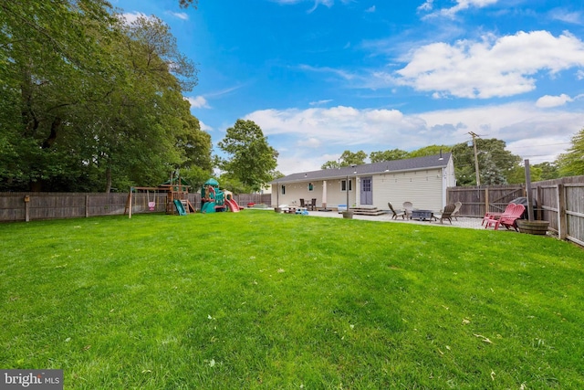 420 Conifer Dr, Forked River, NJ 08731 - view of yard with a playground, a patio area, and an outdoor fire pit