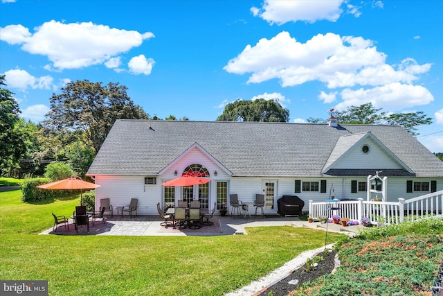 1150 S Mountain Rd, Dillsburg, PA 17019 - back of house with a yard, a shingled roof, and a patio area