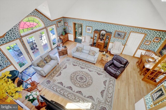 1150 S Mountain Rd, Dillsburg, PA 17019 - living room with wallpapered walls, wood finished floors, high vaulted ceiling, and french doors