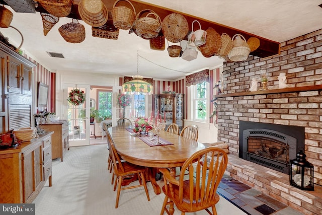 1150 S Mountain Rd, Dillsburg, PA 17019 - dining space with a fireplace and light carpet