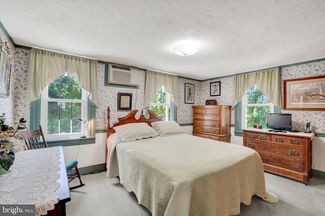 1150 S Mountain Rd, Dillsburg, PA 17019 - bedroom with wallpapered walls, baseboards, light colored carpet, a wall mounted AC, and multiple windows