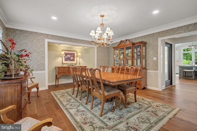 121 Eshelman Rd, Lancaster, PA 17601 - dining space with a chandelier, wallpapered walls, wood finished floors, and crown molding