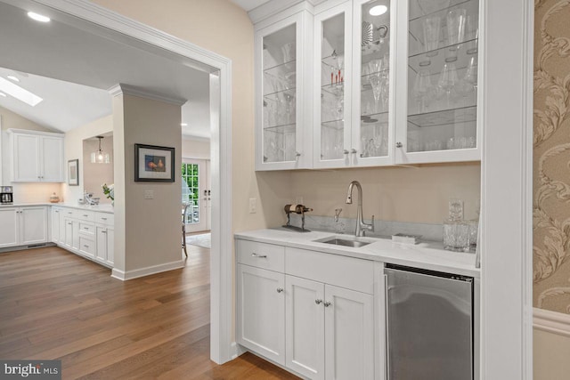 121 Eshelman Rd, Lancaster, PA 17601 - indoor wet bar with refrigerator, wood finished floors, vaulted ceiling, and baseboards