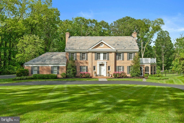 121 Eshelman Rd, Lancaster, PA 17601 - colonial-style house featuring a chimney, a high end roof, and a front yard